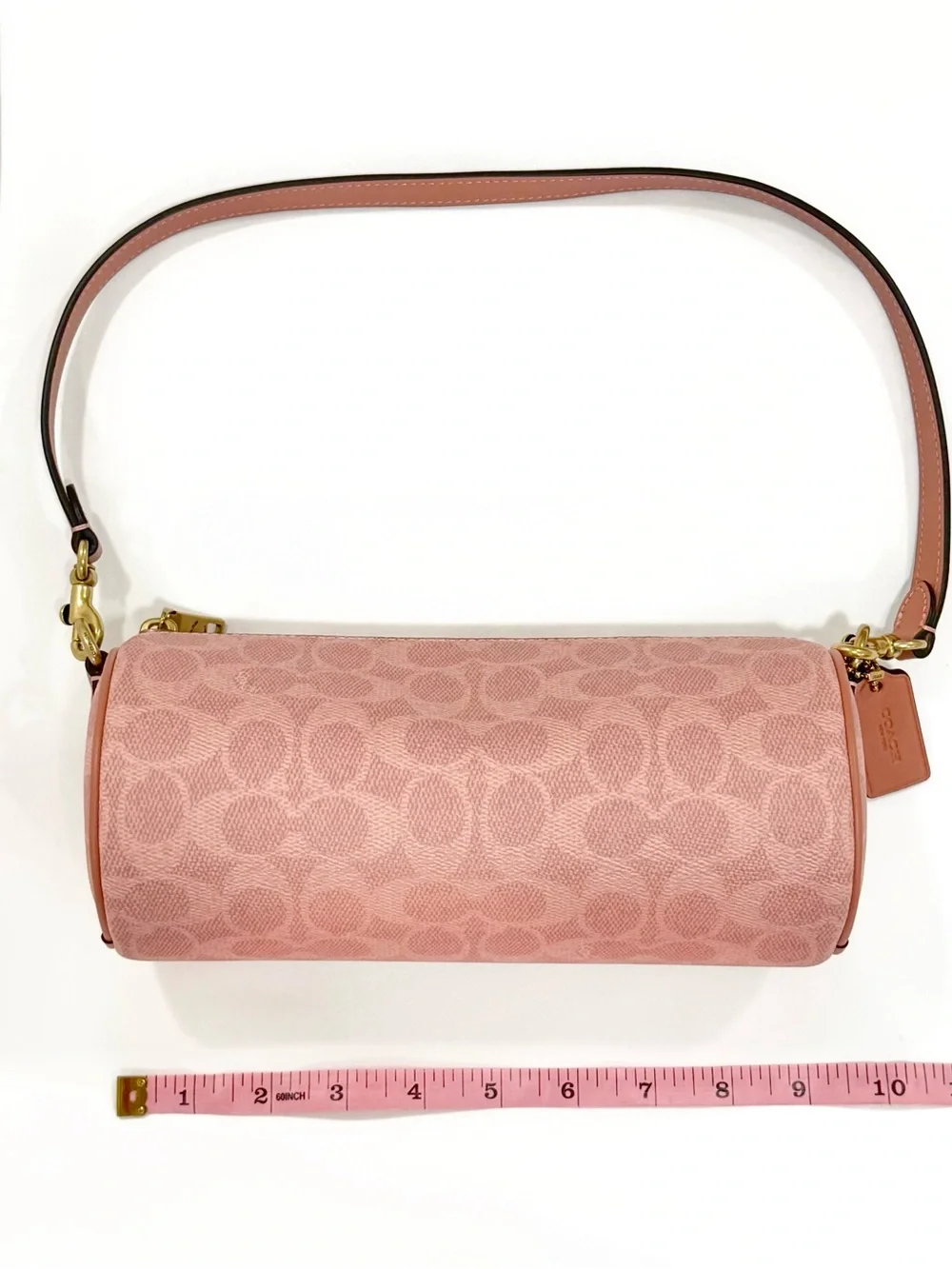 New Coach cylinder barrel bag in melon pink/ brass with signature canvas